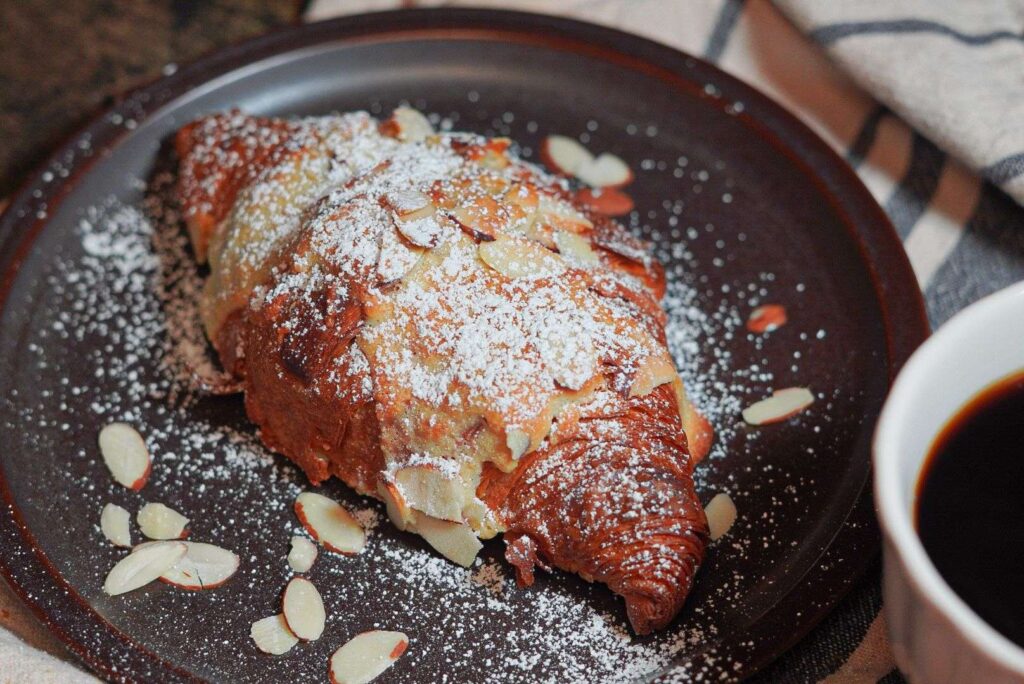 Delicious Almond Croissants served with black coffee