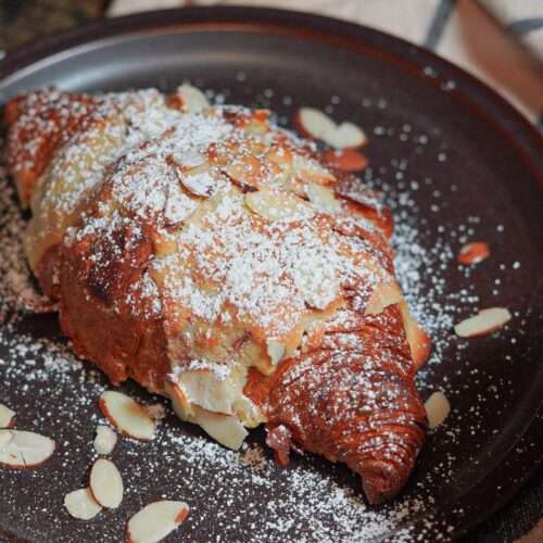 Delicious Almond Croissants served with black coffee
