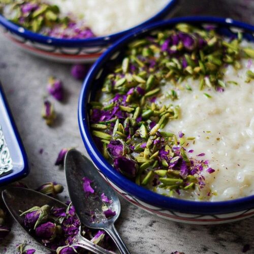 Middle Eastern Rice Pudding bowl served with colorful toppings