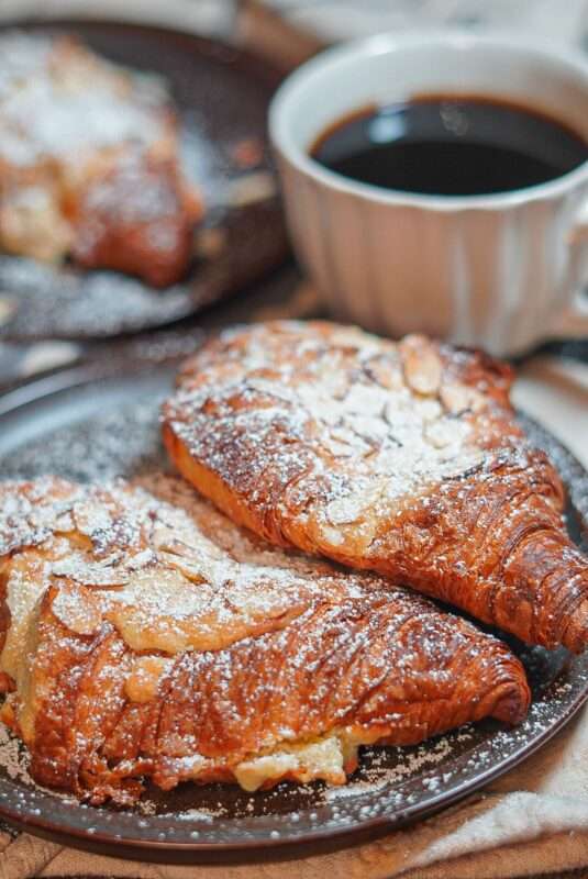 Exquisite Almond Croissants served with black coffee