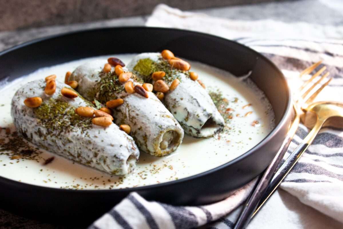 Sheikh Makhshi (Kusa Bi Laban) mouthwatering plate with zucchinis stuffed with ground meat and dunked in a tasty yogurt sauce!