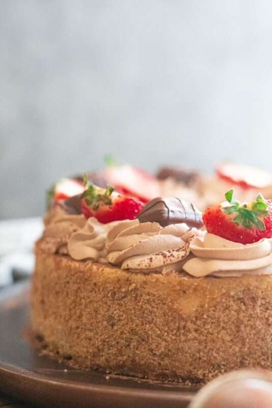 decadent and delicious tiramisu cheesecake that has creamy coffee flavored filling with a white chocolate whipped cream