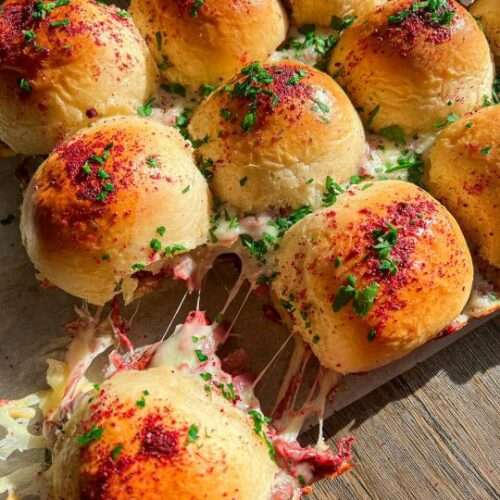 These fluffy sliders are baked in the oven with mozzarella cheese within. They contain the most tender chicken musakhan ever.