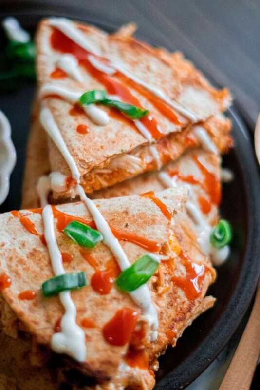Hot, crispy, and cheesy buffalo chicken quesadillas served with extra sour cream on the side. 