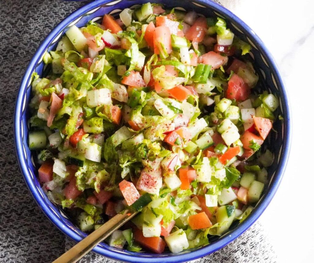 Lots of freshly cut vegetables with juicy lemon.