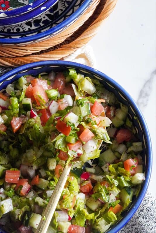 A crazy Arabic Chopped Salad filled with generously cut pieces of equal sizes from different fruits and vegetables.