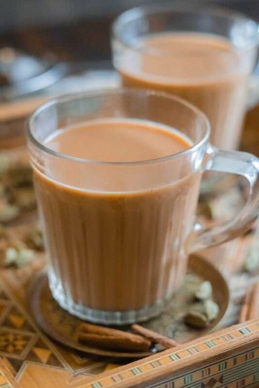 Hot tea with evaporated milk and aromatic spices.
