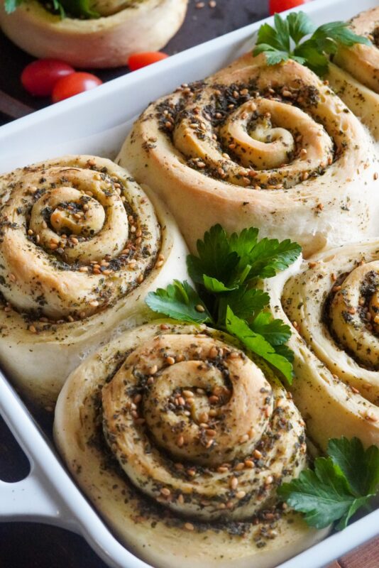a baking tray with spiral dough filled with zaatar