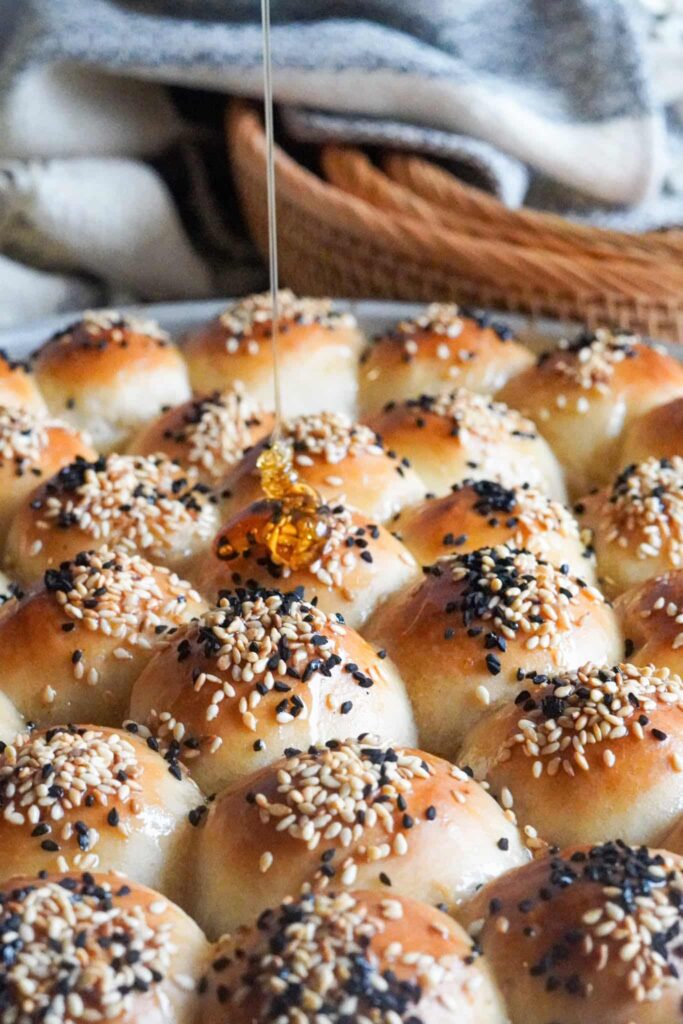 a drizzle of utterly divine honey of golden baked Honeycomb Bread topped with sesame and Nigella seeds