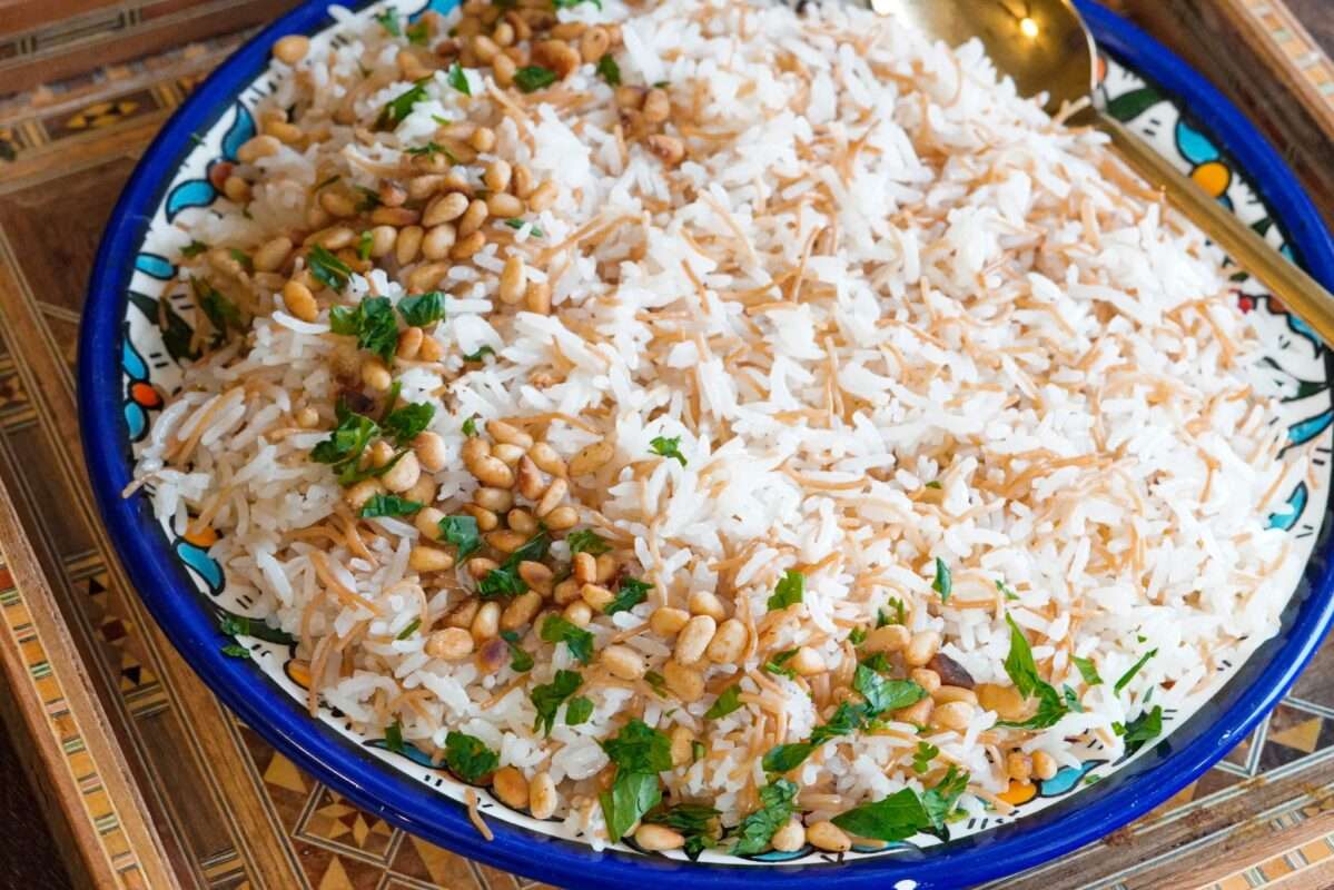 fluffy vermicelli rice dish topped with sautéed pine nuts and finely chopped parsley