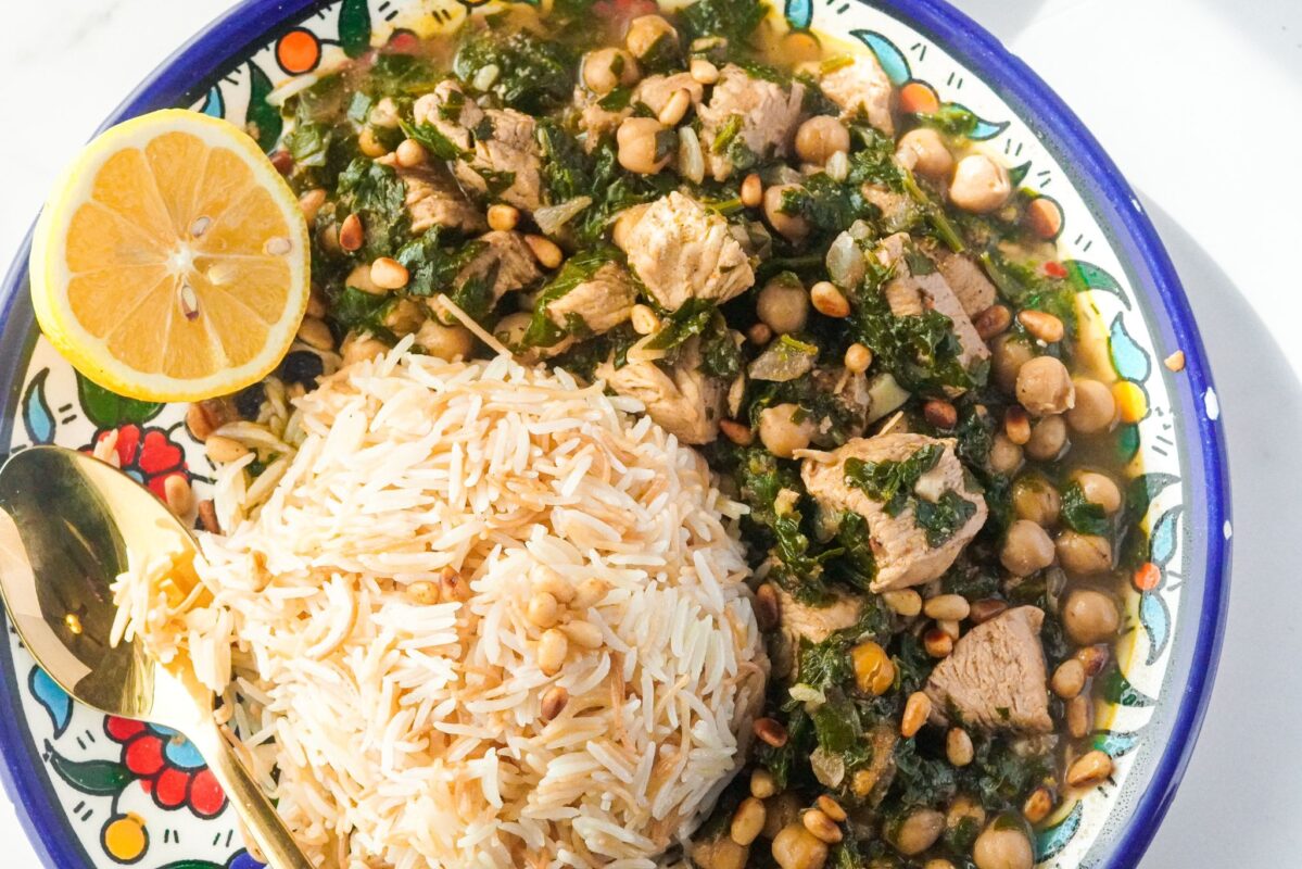 This spinach stew served with rice and topped with peas and toasted pine nuts and it's one of the easiest Middle Eastern dishes to cook