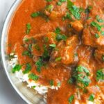 Vibrant beef curry stew served on top of white rice