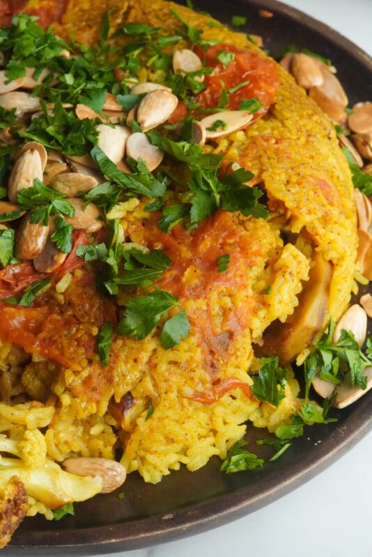 A dish of amazing things inside, from the tasty golden rice to the mouthwatering veggies and nuts