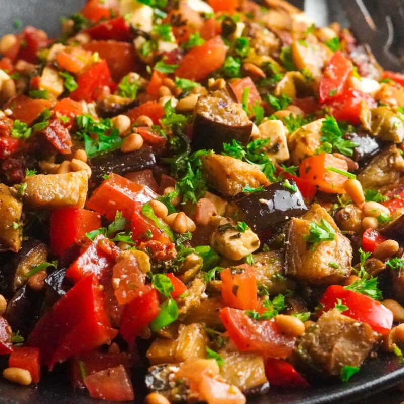 a bowl of super yummy roasted eggplant salad that has a smoky and earthy taste