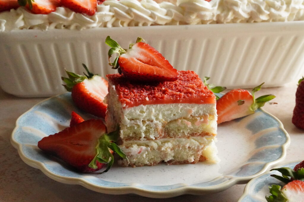 creamy strawberry tiramisu topped with crushed freeze-dried strawberries and fresh strawberries