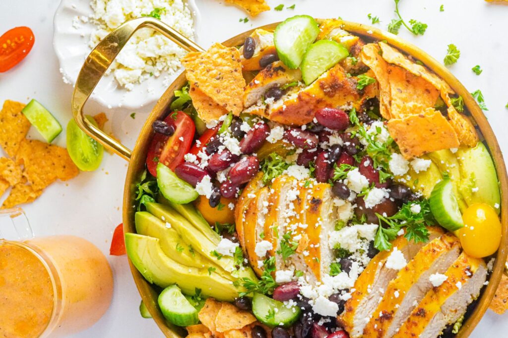 This salad is a delightful blend of fresh ingredients, tender chicken, and a creamy chipotle dressing that adds a kick of spice.