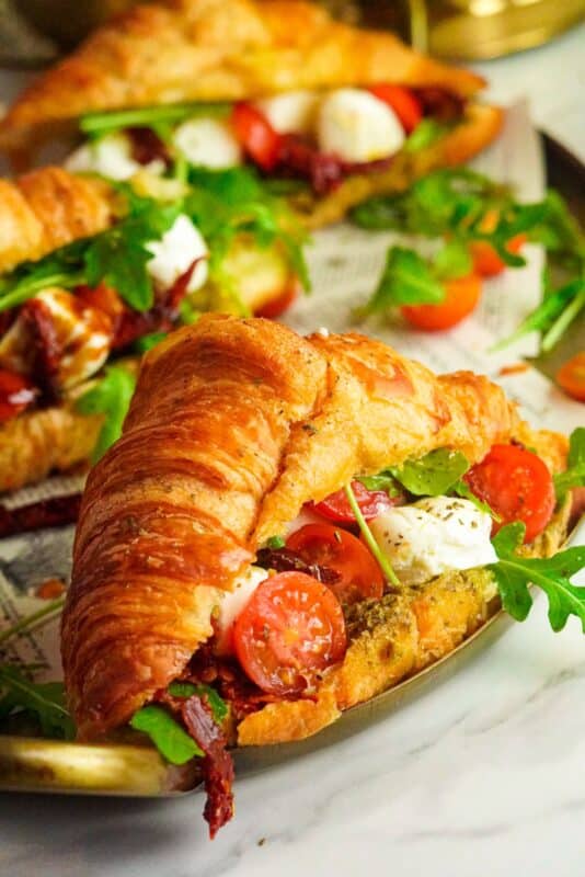 flaky croissant stuffed with pesto sauce, sundried and fresh tomatoes, fresh greens, and mozzarella cheese.