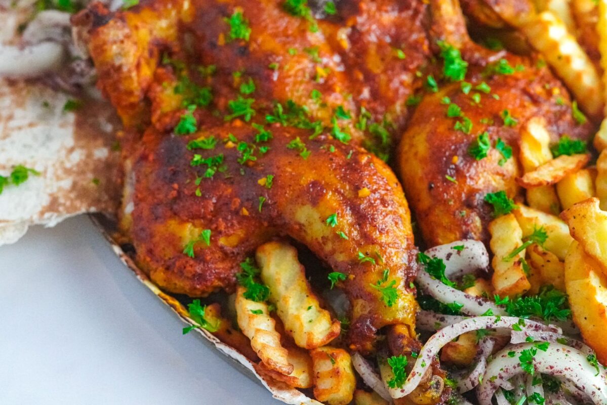 irresistibly delicious oven-baked chicken delight with flavorful garlic paste and crispy French fries