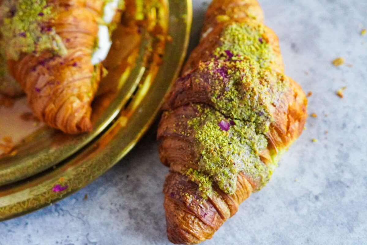 A large twice baked croissant stuffed with Middle Eastern filling