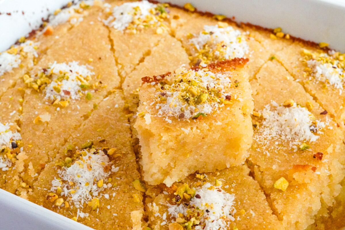 Basbousa is a mouthwatering Middle Eastern dessert cherished for its unique blend of textures and sweet flavors. It's primarily composed of semolina, sugar, and yogurt, creating a tender yet crumbly cake. What sets Basbousa apart is its aromatic syrup infusion, making it a delightful treat soaked in sugary bliss.