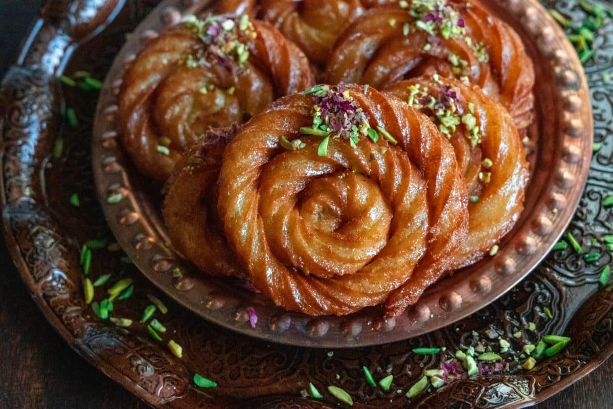 Golden Mushabak made into spiral shapes, dipped into simple syrup. 