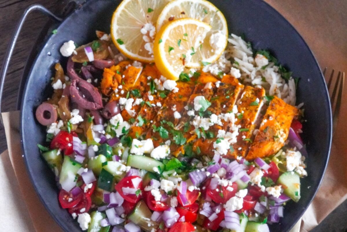 Chicken Rice Bowls This wholesome recipe is served with Kalamata olives, quartered cherry tomatoes, chopped diced cucumbers, chopped red onions, and feta cheese.