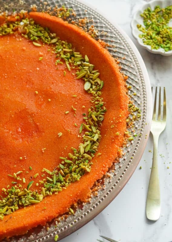 Palestinian Knafeh Recipe cheesy knefe bi jibin topped with pistachios