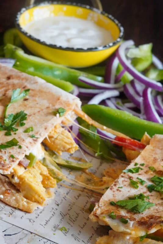 A lot of fresh vegetables inside this crunchy tortilla chicken fajita.