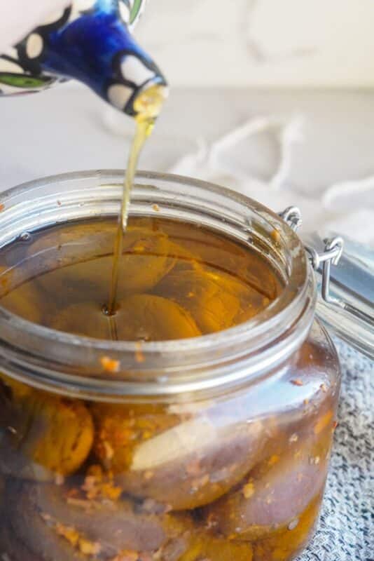 a drizzle of olive oil in a jar of middle eastern stuffed eggplants pickles