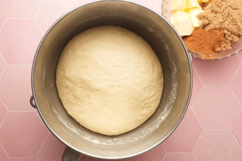 a shot of the cinnamon rolls dough in a lightly oiled bowl